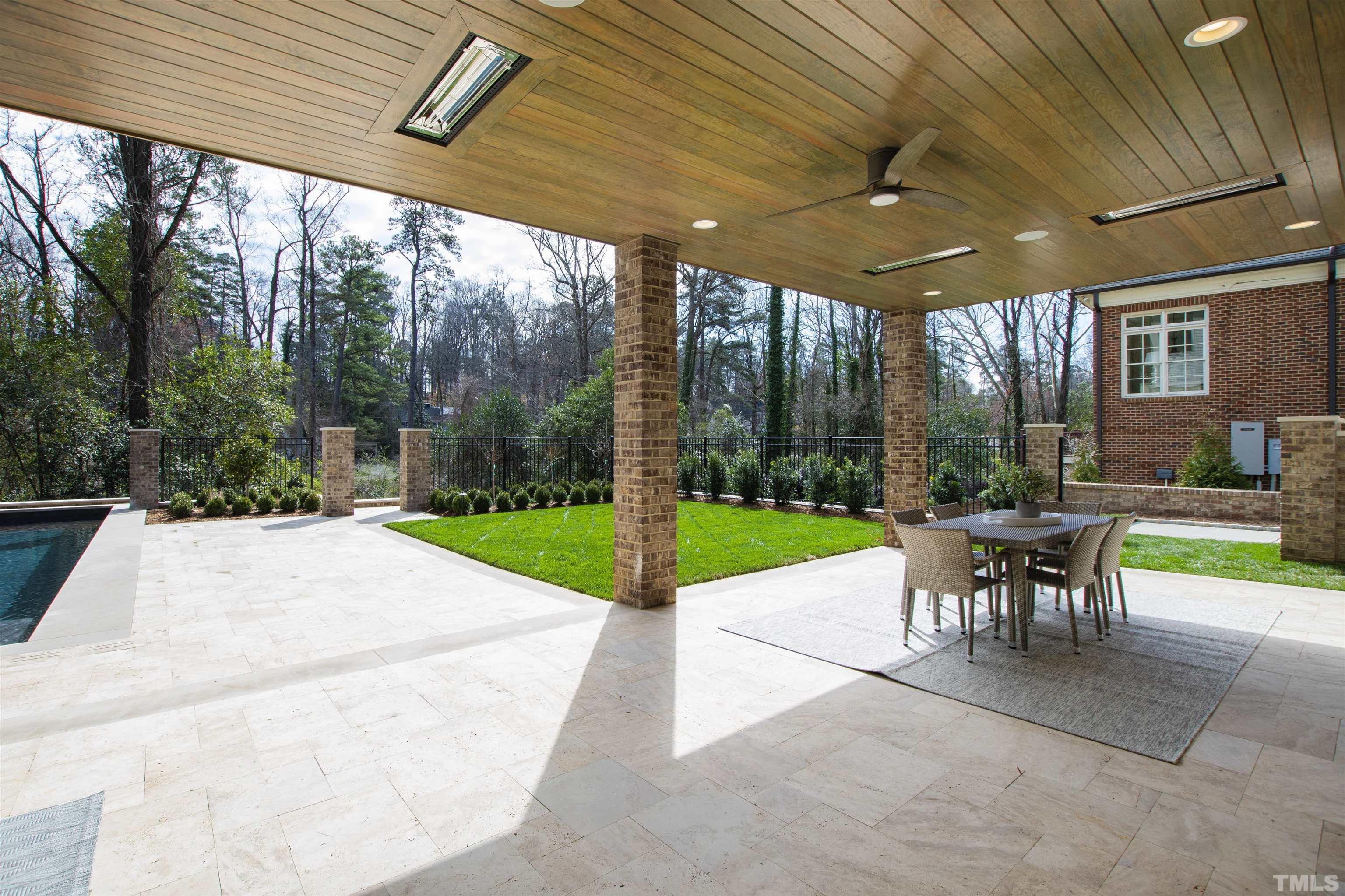1716 Nottingham Road Raleigh, NC 27607 - Photo 73 of 78 a view of a patio with a table chairs and a backyard