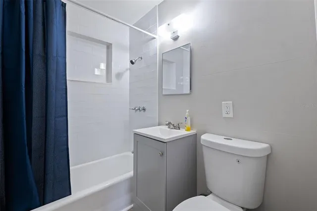 a bathroom with a toilet a sink and bathtub