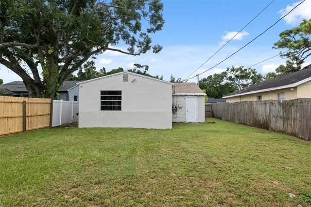 a house view with a backyard space