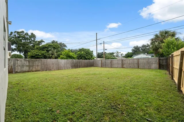 a view of a backyard with a trampoline
