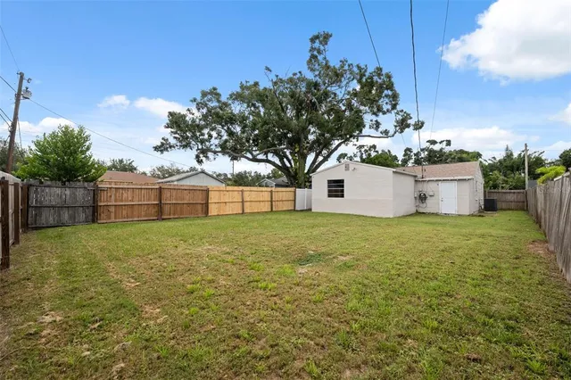 a backyard of a house with lots of green space