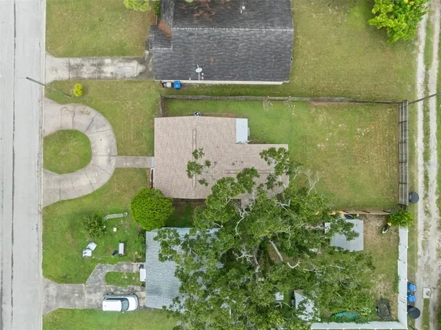 an aerial view of a house with a swimming pool