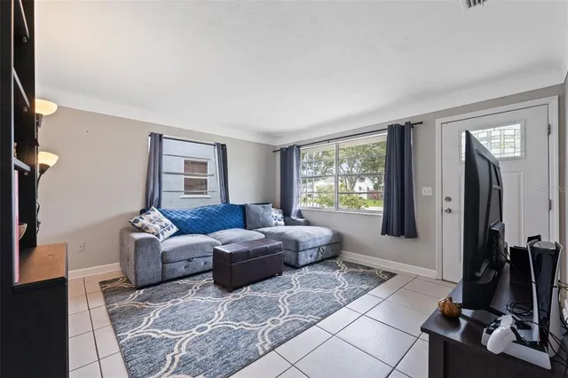 a living room with furniture and a window