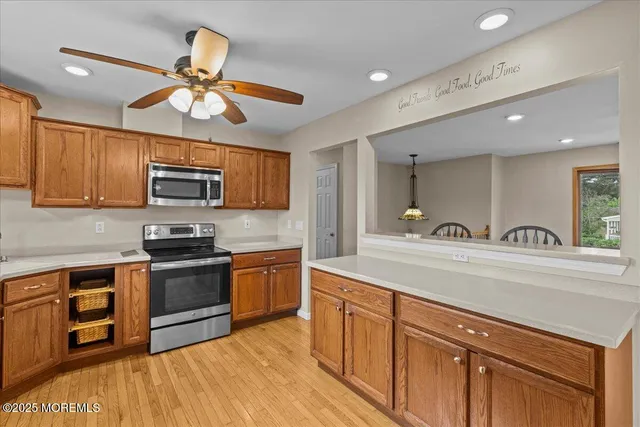 a kitchen with stainless steel appliances granite countertop a sink and stove top oven