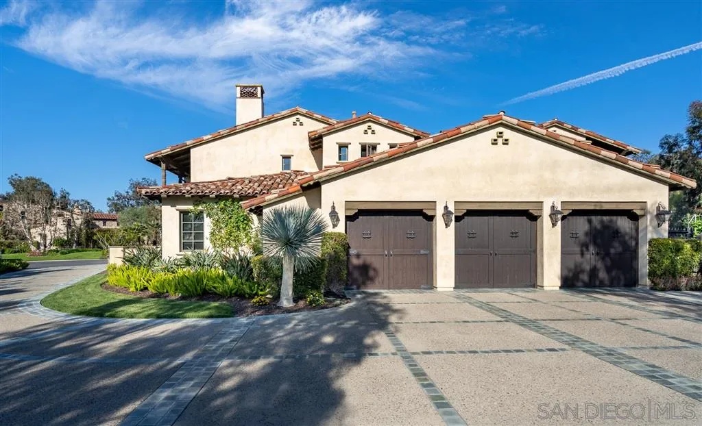 6973 Corte Lusso Rancho Santa Fe, CA 92091 - Photo 1 of 1 a front view of a house with garden