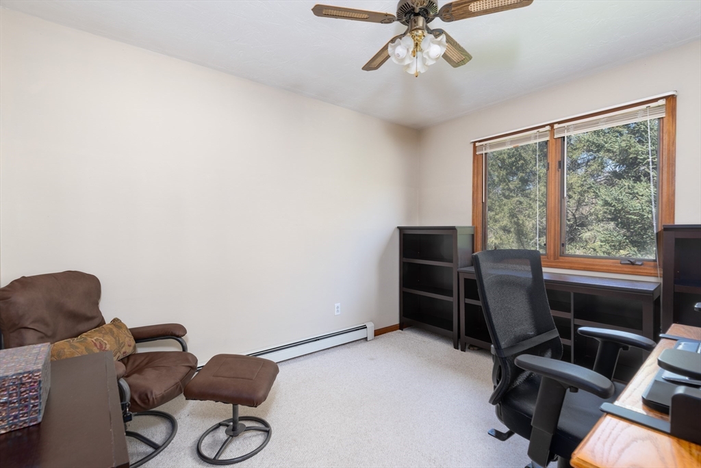 27 Dudley Road Sutton, MA 01590 - Photo 16 of 42 a room with furniture and gym equipment