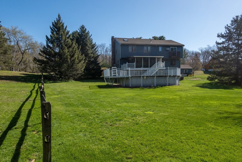 27 Dudley Road Sutton, MA 01590 - Photo 31 of 42 a view of a house with a yard and sitting area