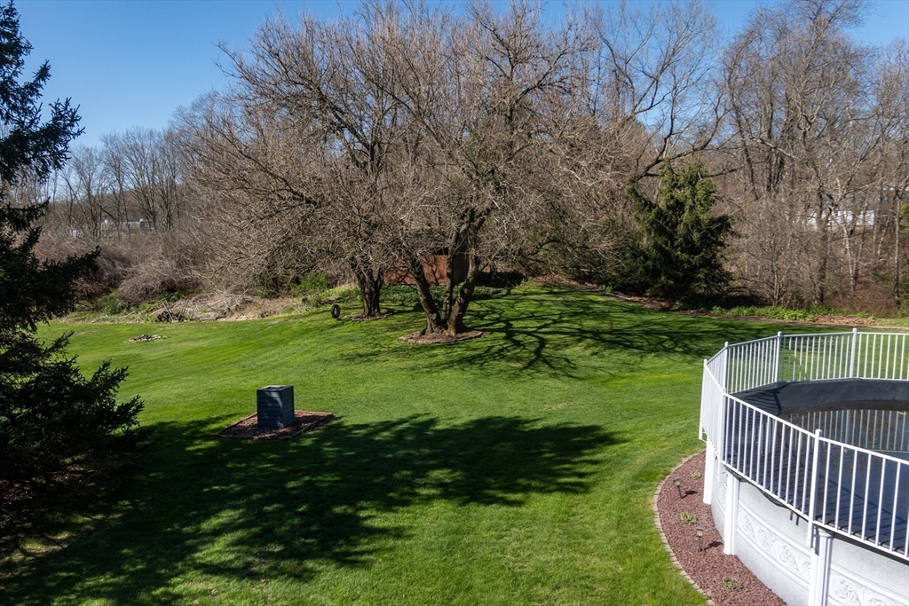 27 Dudley Road Sutton, MA 01590 - Photo 33 of 42 a view of a backyard with large trees