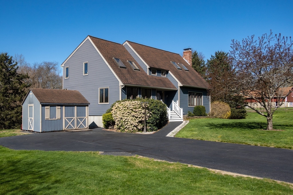 27 Dudley Road Sutton, MA 01590 - Photo 37 of 42 a front view of a house with garden