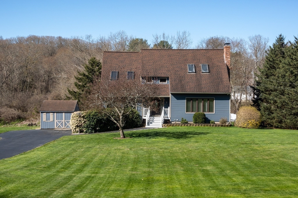 27 Dudley Road Sutton, MA 01590 - Photo 41 of 42 a view of a building with a yard