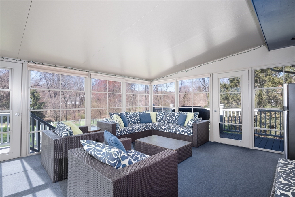 27 Dudley Road Sutton, MA 01590 - Photo 6 of 42 a living room with furniture and a large window