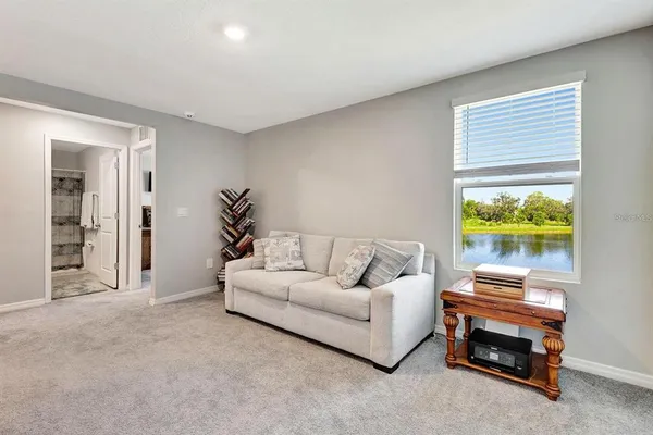 a living room with furniture and a window