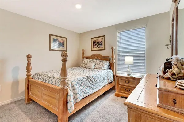 a bed room with a bed and a window