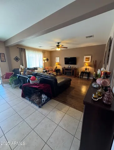 a kitchen with stainless steel appliances kitchen island granite countertop a sink cabinets and a dining table