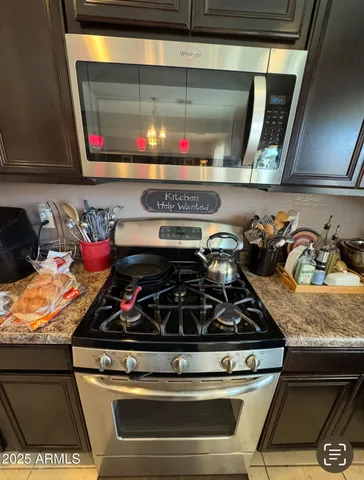 a living room with furniture and a mirror