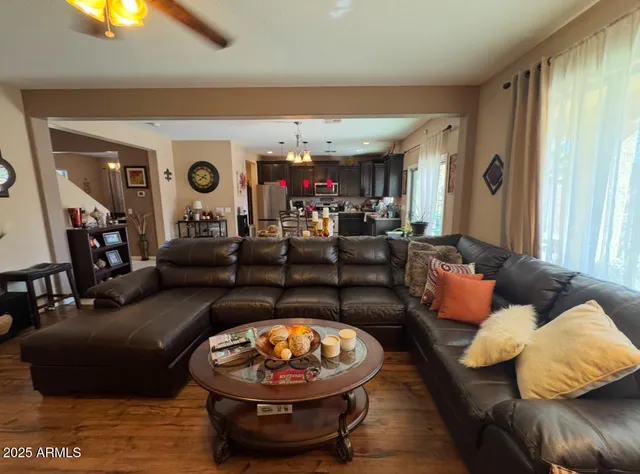 a living room with furniture and a lamp
