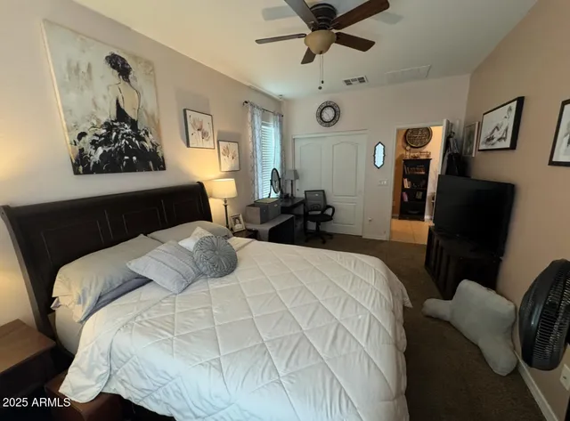 a bed room with a bed and a couch