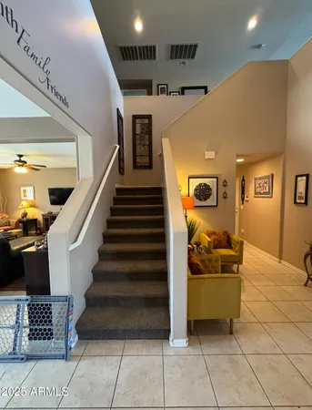 a bedroom with bed and a chandelier
