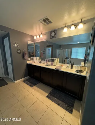 a view of a livingroom with furniture and a flat screen tv