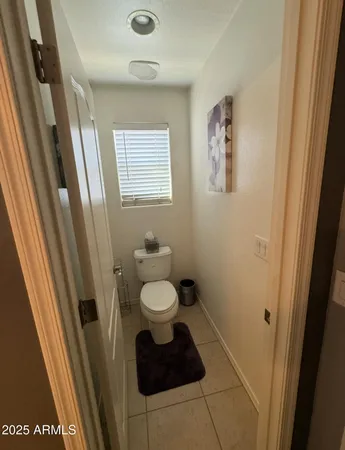 a bedroom with a bed and a desk