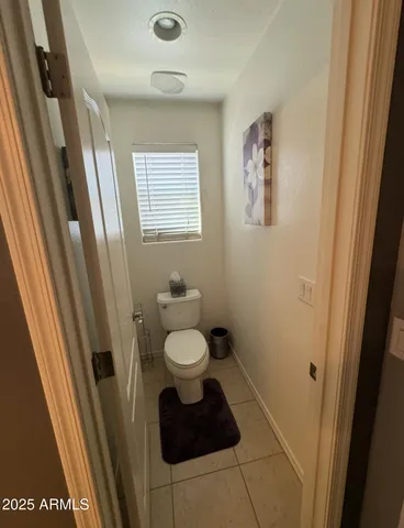 a bedroom with a bed and a desk