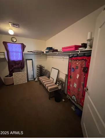 a view of room with stairs and a wooden floor