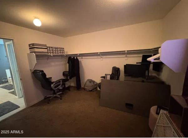 a view of livingroom with furniture and windows