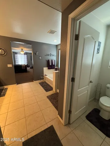a view of a roof deck with table and chairs under an umbrella