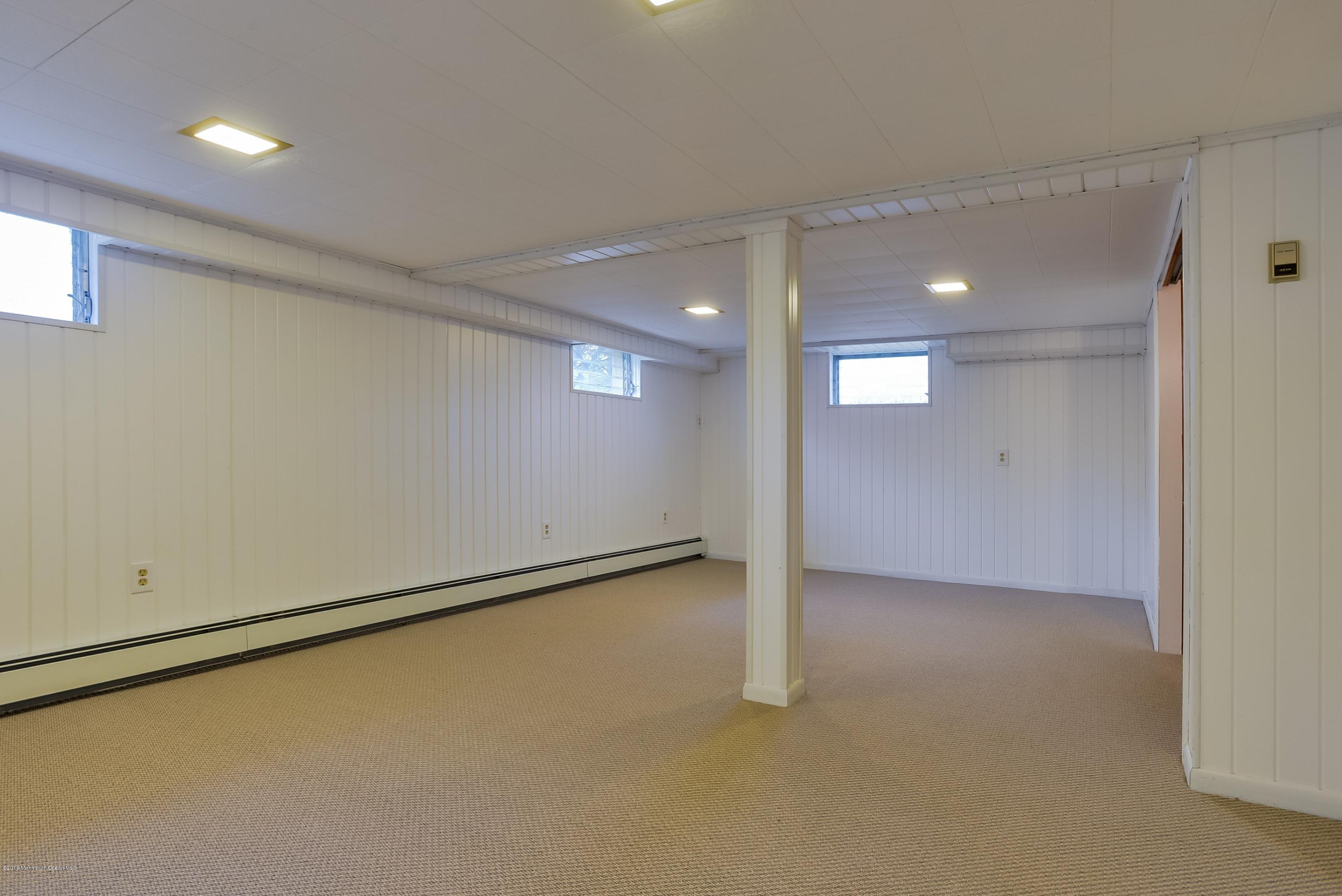 229 Pinecrest Road Oakhurst, NJ 07755 - Photo 11 of 12 an empty room with an entryway