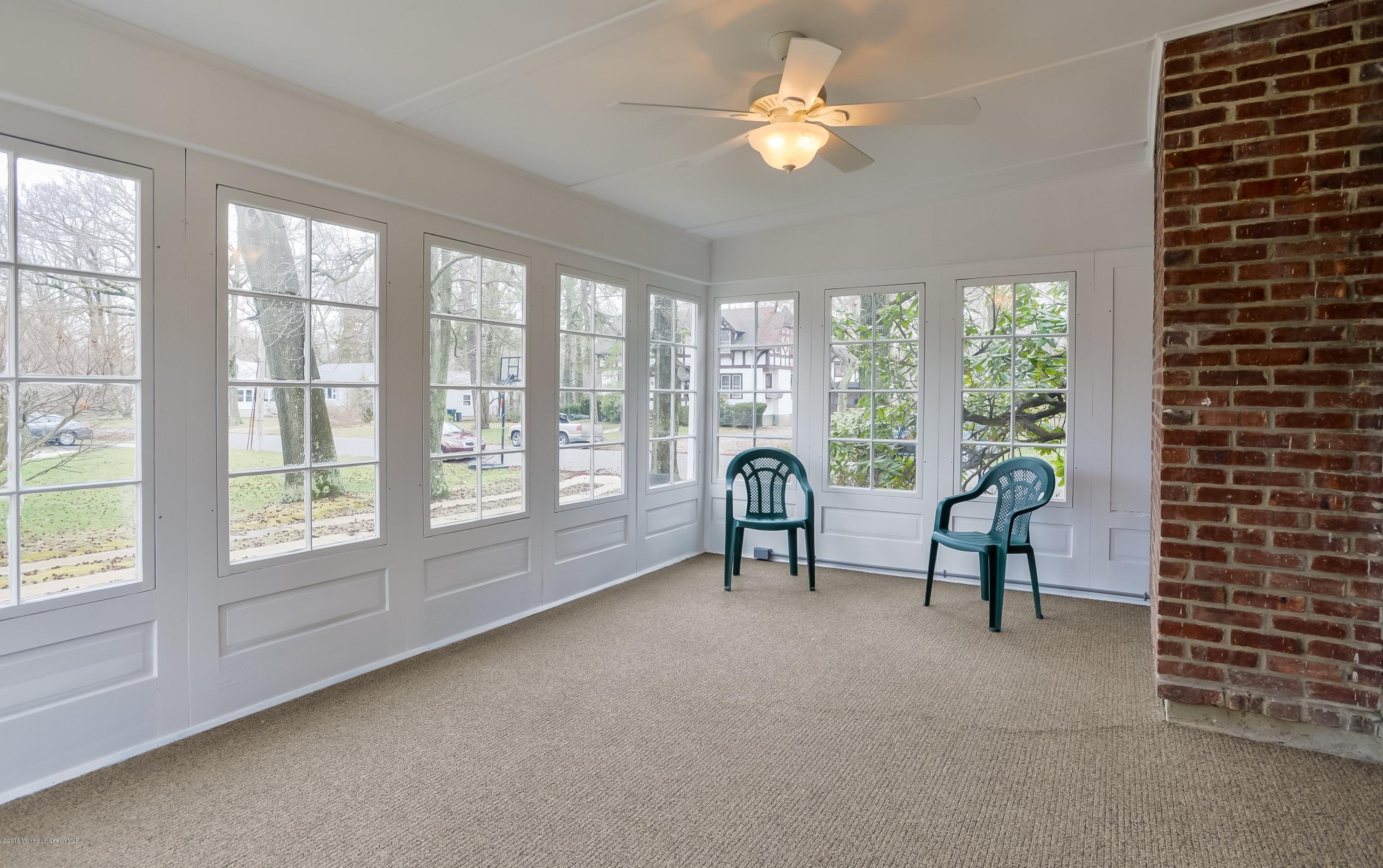 229 Pinecrest Road Oakhurst, NJ 07755 - Photo 10 of 12 a view of a livingroom with furniture and a large window