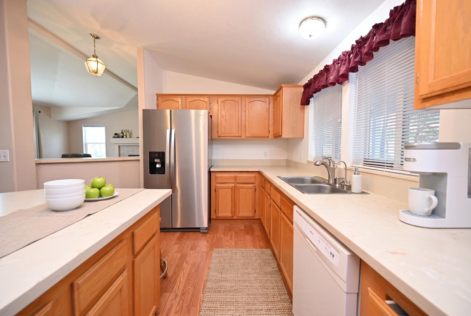 4360 Pleasant Valley Road Placerville, CA 95667 - Photo 54 of 71 a kitchen with a sink and refrigerator