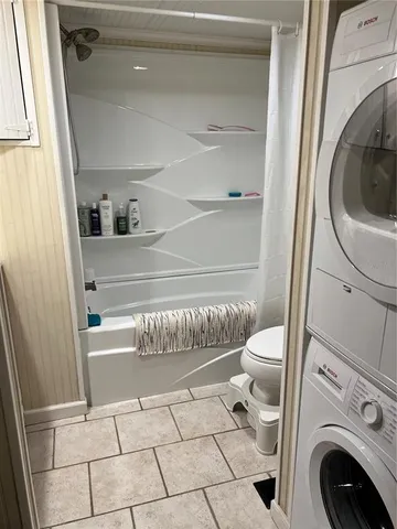 a bathroom with a washer and dryer