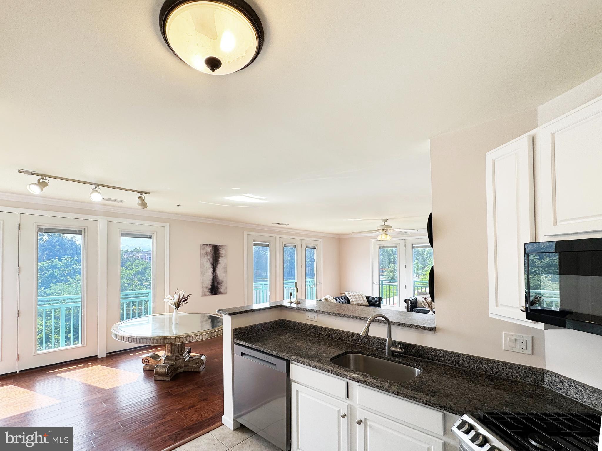 12001 Market Street, Unit 124 Reston, VA 20190 - Photo 8 of 42 Kitchen Open to Living Areas