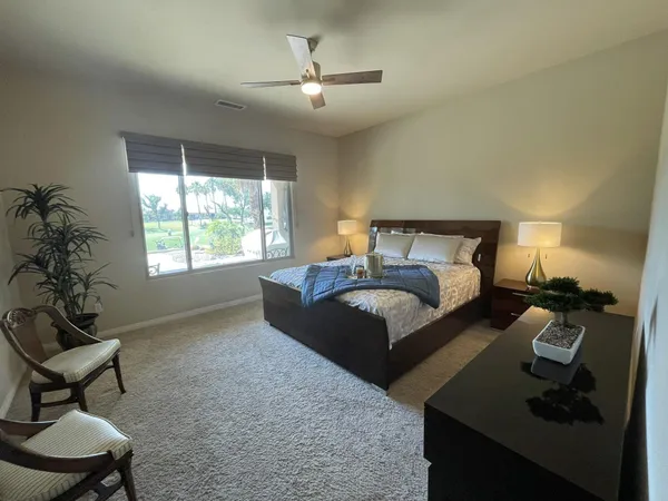 a bedroom with a bed and window