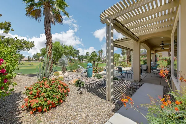 a outdoor living space with patio furniture and a potted plant
