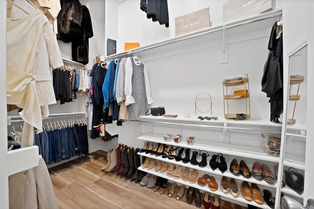 1709 Shetland Road Aubrey, TX 76227 - Photo 22 of 35 a view of walk in closet with clothes and shoes