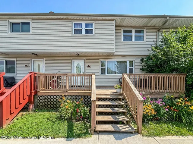 a view of a deck with barbeque grill wooden floor and fence