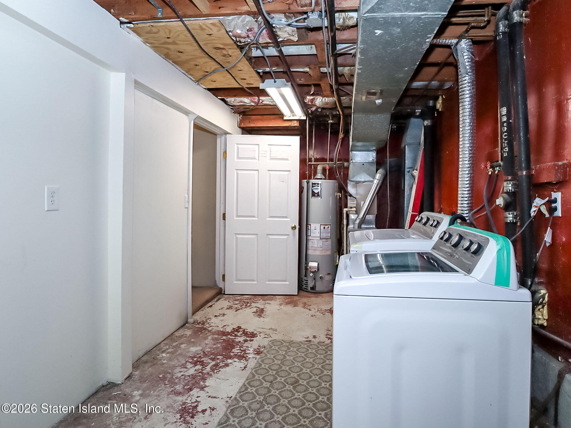 537 Willow Road East, Unit 1 Staten Island, NY 10314 - Photo 19 of 23 a view of storage and utility room with stairs