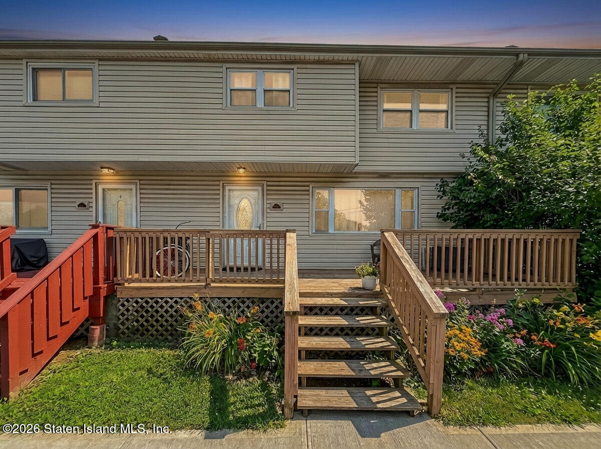 537 Willow Road East, Unit 1 Staten Island, NY 10314 - Photo 2 of 23 a view of a house with wooden deck and furniture