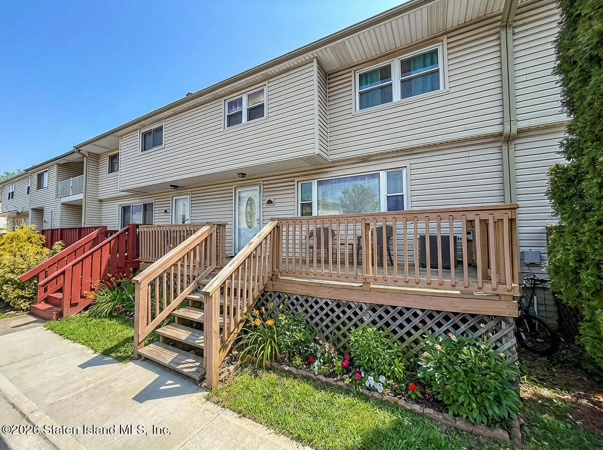 537 Willow Road East, Unit 1 Staten Island, NY 10314 - Photo 23 of 23 a view of a house with wooden deck