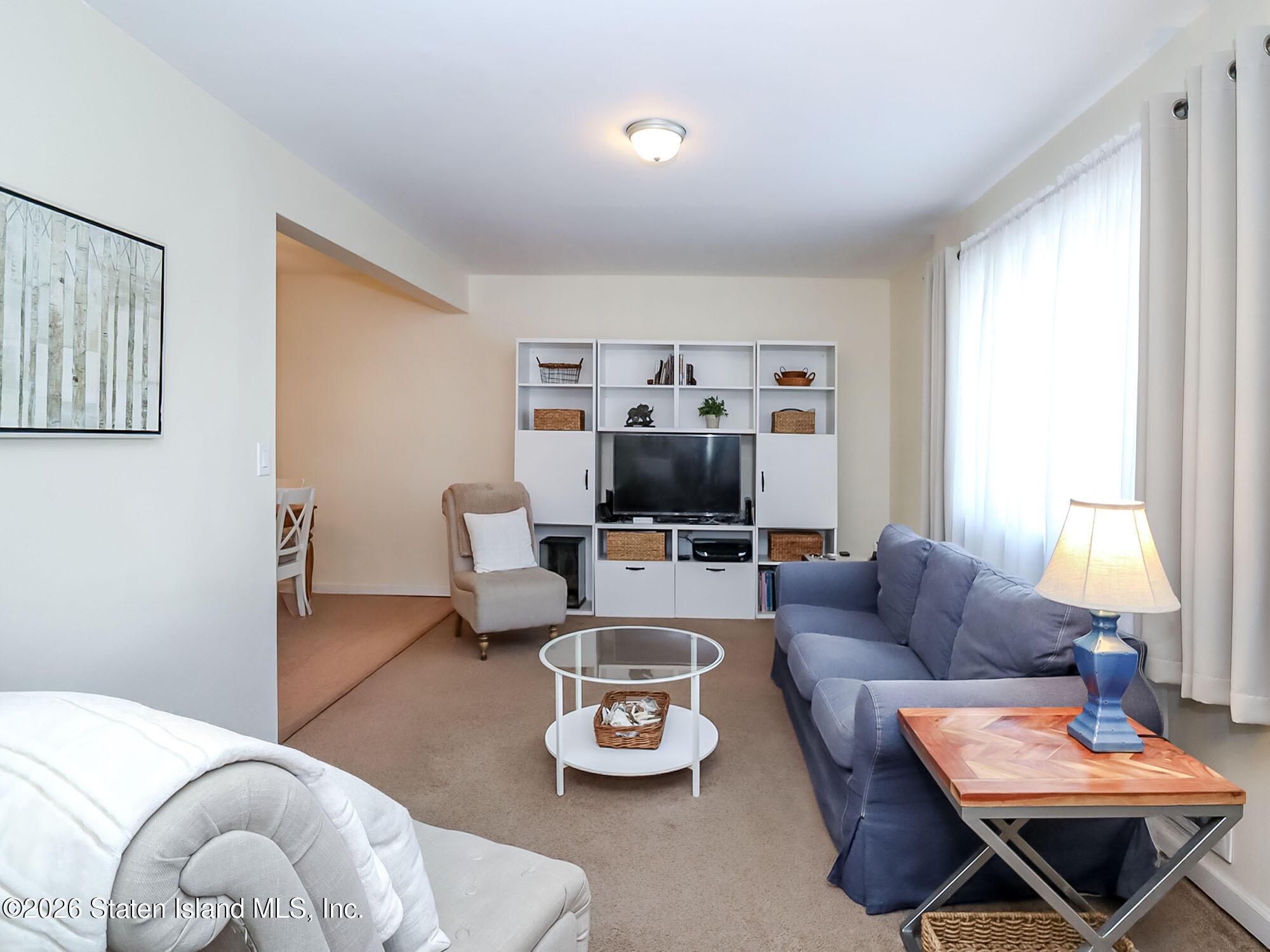 537 Willow Road East, Unit 1 Staten Island, NY 10314 - Photo 5 of 23 a living room with furniture and a window