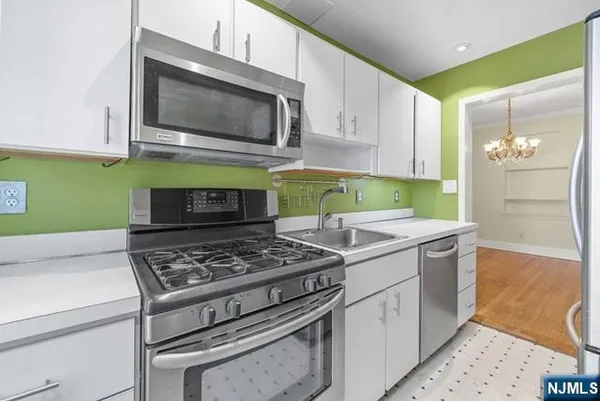 a kitchen with a stove and a microwave