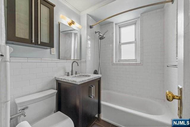 100 Prospect Avenue, Unit 5K Hackensack, NJ 07601 - Photo 6 of 11 a bathroom with a granite countertop sink toilet and shower