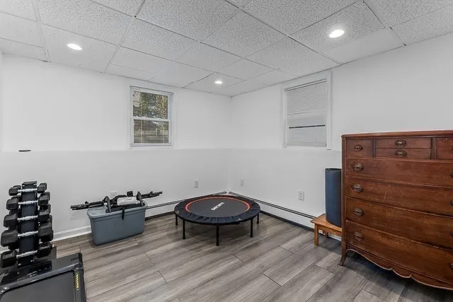 a room with a chair and white walls