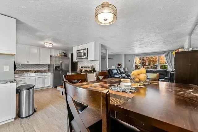 a kitchen with a sink appliances and cabinets