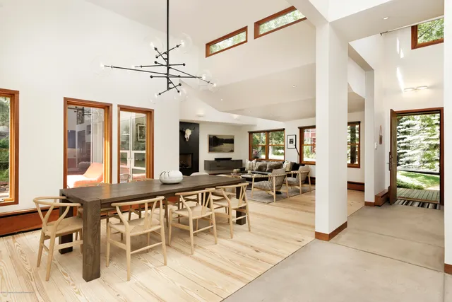 a view of a livingroom with furniture and a window