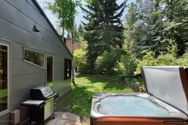 a view of backyard with outdoor seating