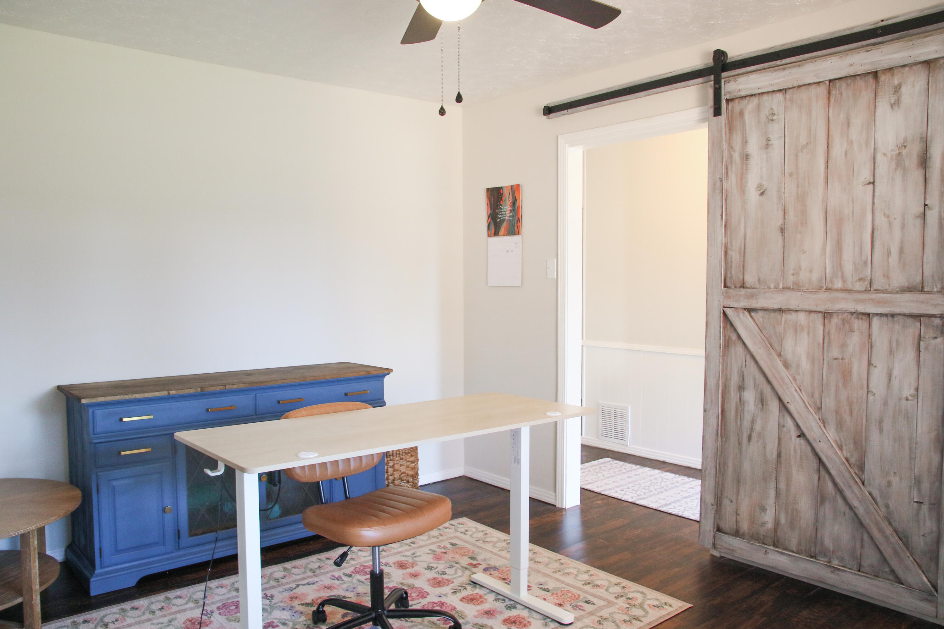 3306 61st Street Lubbock, TX 79413 - Photo 3 of 18 a view of a room with wooden floor wooden table and chairs