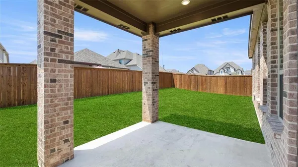 a view of a back yard from a patio