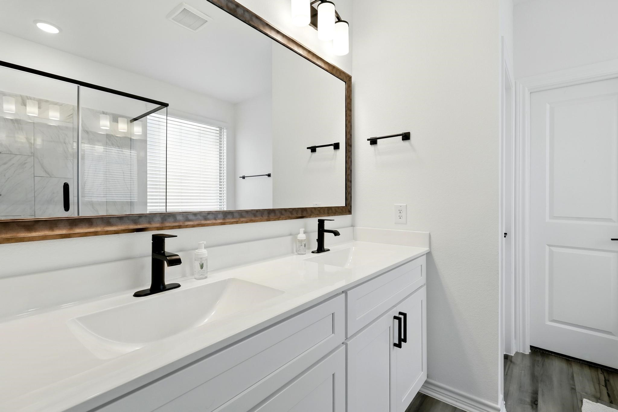15727 Rosemary Hl Lane Conroe, TX 77302 - Photo 11 of 28 a bathroom with a sink and a mirror